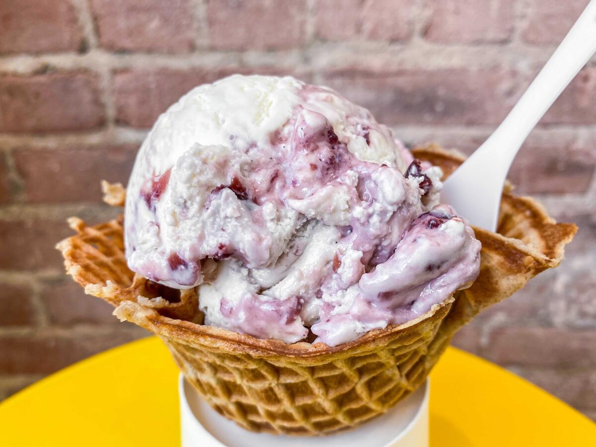 Vanilla Cherry Whiskey ice cream in a waffle bowl at Ginger's Divine Ice Cream on West 3rd Street