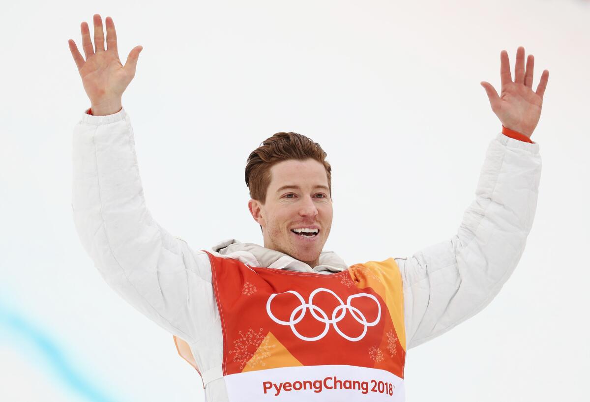 Gold medalist Shaun White celebrates during the victory ceremony.