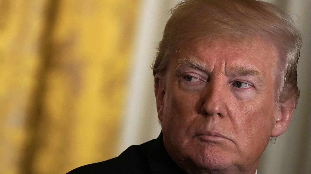 President Donald Trump listens during a joint news conference in the East Room of the White House on April 3.