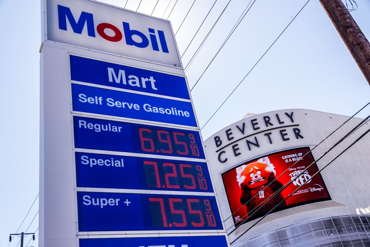 A sign with gas prices at the Mobil station at Cienega and Beverly boulevards.