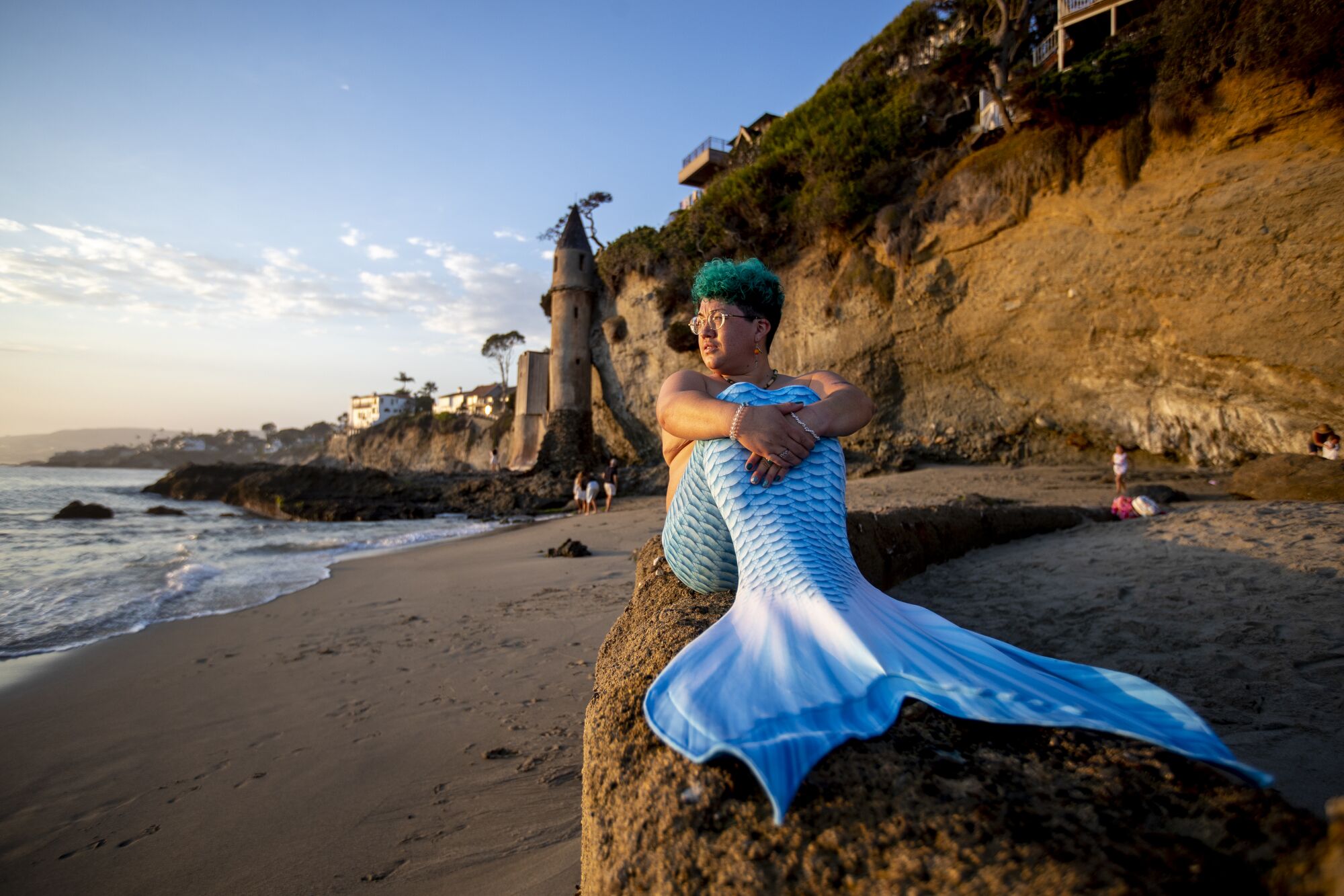 Sammy Silva poses on Victoria Beach in Laguna Beach, wearing a mermaid monofin.