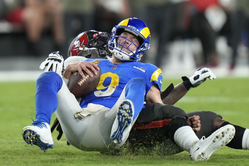 Los Angeles Rams quarterback Matthew Stafford (9) is sacked by Tampa Bay Buccaneers defensive tackle Rakeem Nunez-Roches during the second half of an NFL football game Wednesday, Nov. 9, 2022, in Tampa, Fla. (AP Photo/Chris O'Meara)