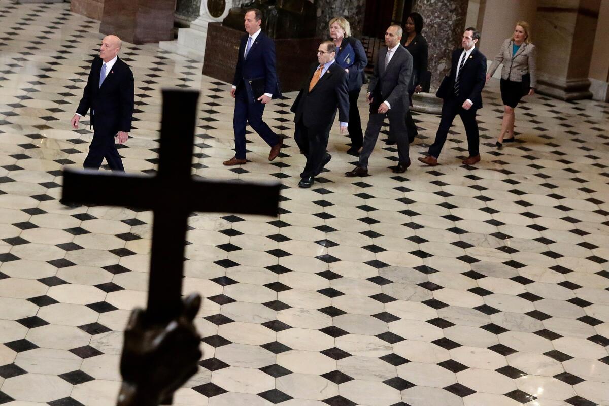 House Sergeant at Arms Paul Irving leads the seven House managers to the Senate chamber.