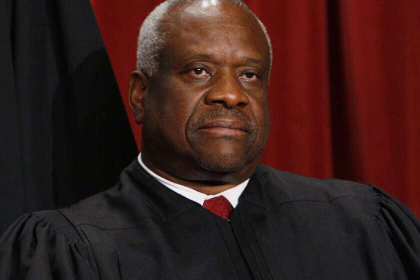 U.S. Supreme Court Justice Thomas says his colleagues are fixated on racial quotas instead of voting rights.