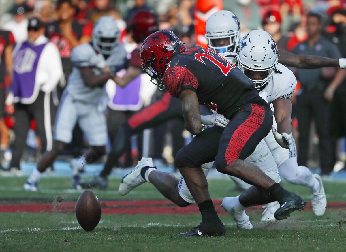 San Diego State running back Greg Bell fumbles the ball against Utah State 