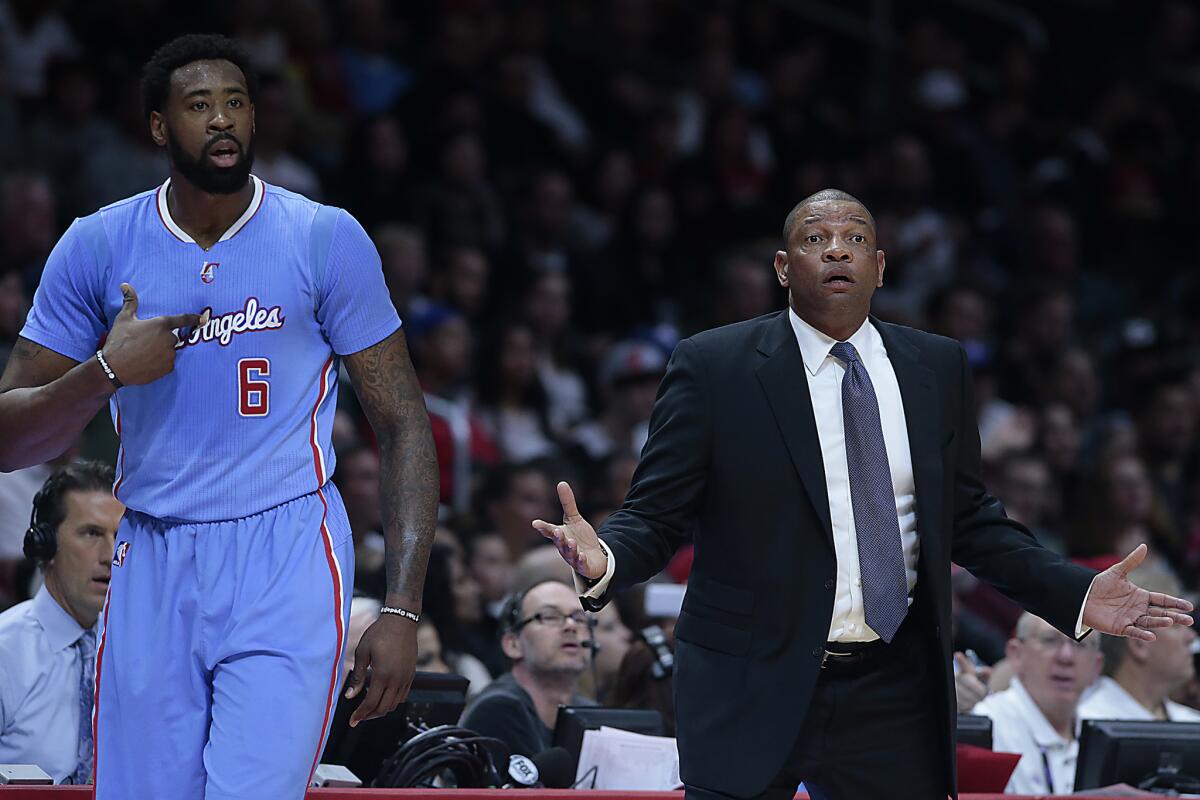 Clippers Coach Doc Rivers and center DeAndre Jordan look for answers from the referees on Jan. 11.