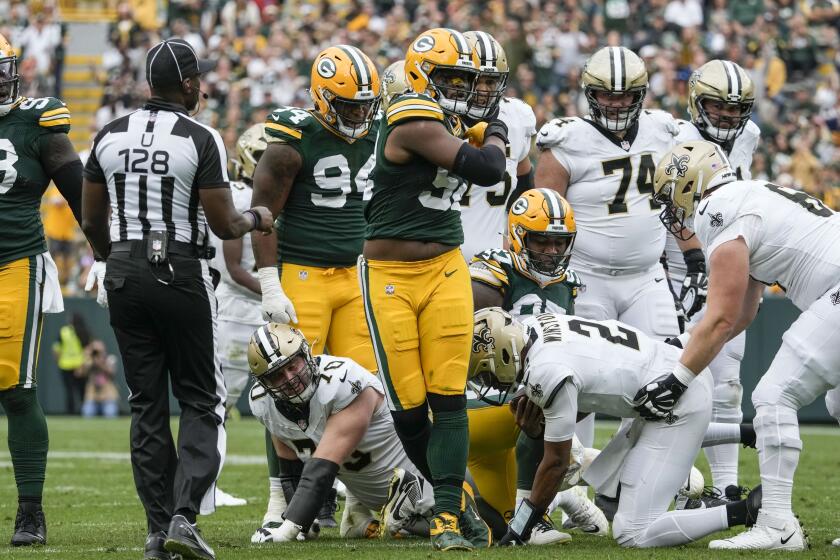 Green Bay Packers linebacker Rashan Gary reacts after sacking New Orleans Saints quarterback Jameis Winston (2) during the second half of an NFL football game Sunday, Sept. 24, 2023, in Green Bay, Wis. (AP Photo/Morry Gash)