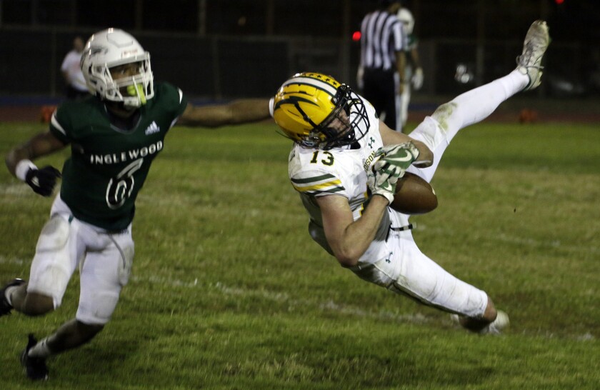 Tyler Hampton from Edison tries to pull in a pass Friday night versus Inglewood.