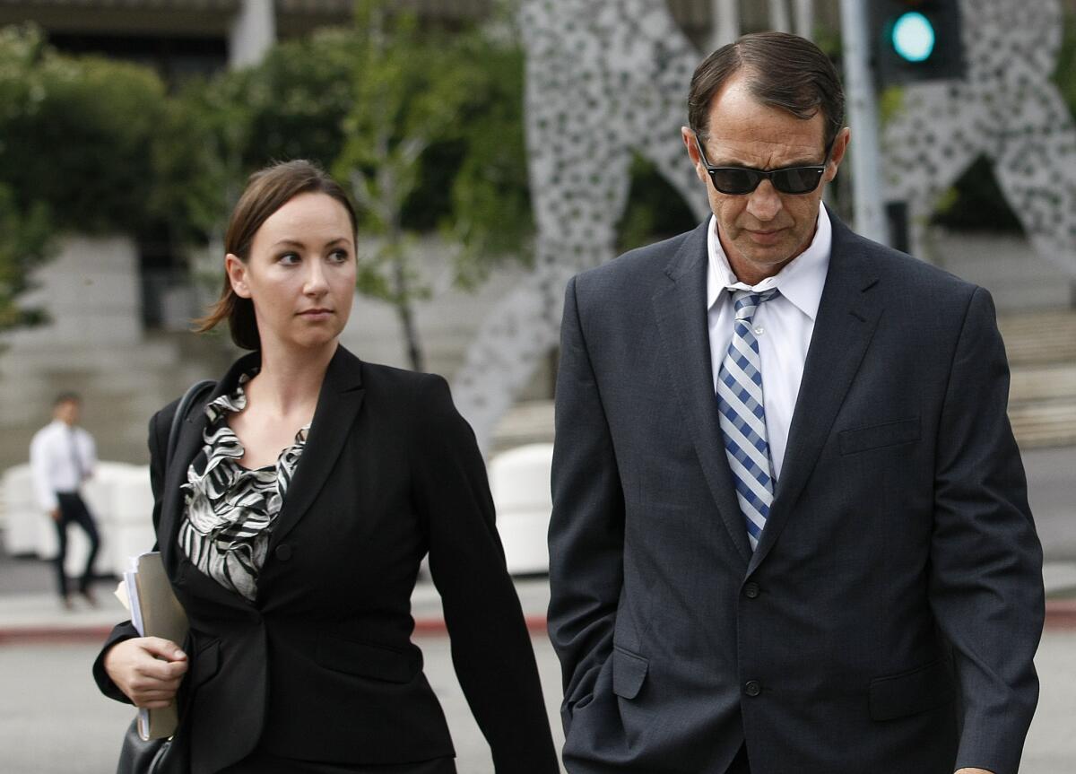 Retired L.A. County Sheriff's Capt. William Thomas Carey leaves the Roybal federal courthouse in Los Angeles after appearing for an arraignment on May 14.