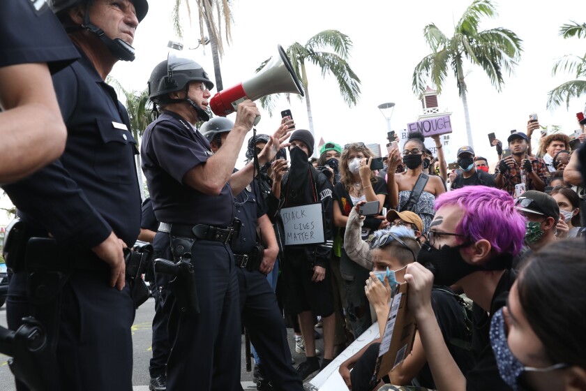 Los Los Angeles Police Chief Michel Moore addresses protesters at 3rd Street and Fairfax Avenue on May 30.