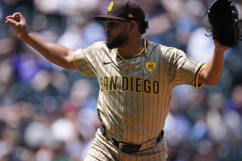 San Diego Padres starting pitcher Randy Vásquez (98) in the first inning of a baseball game Thursday, April 25, 2024, in Denver. (AP Photo/David Zalubowski)