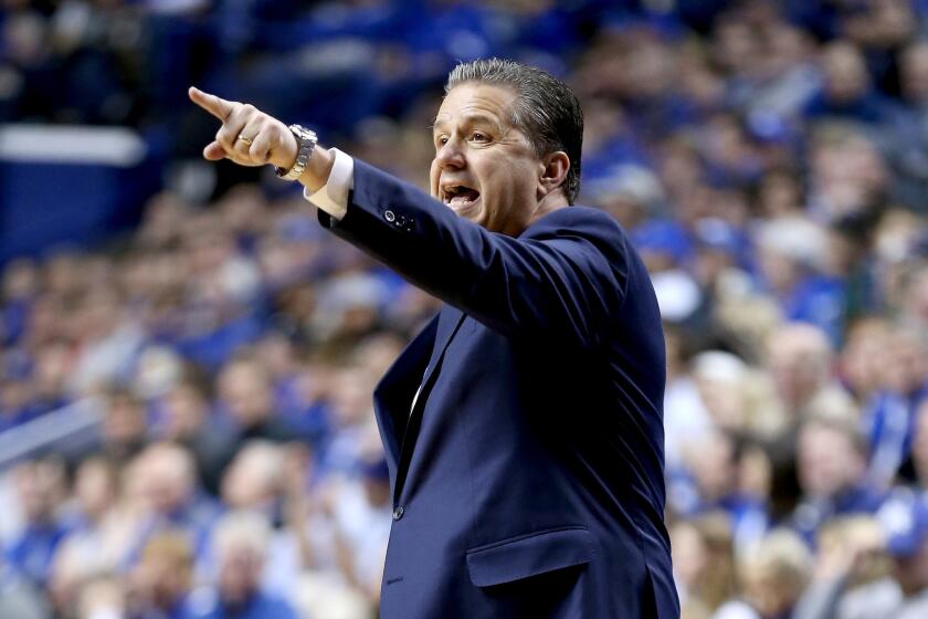 Kentucky Coach John Calipari gives insturctions to his team during a game against Mississippi State on Jan. 12.