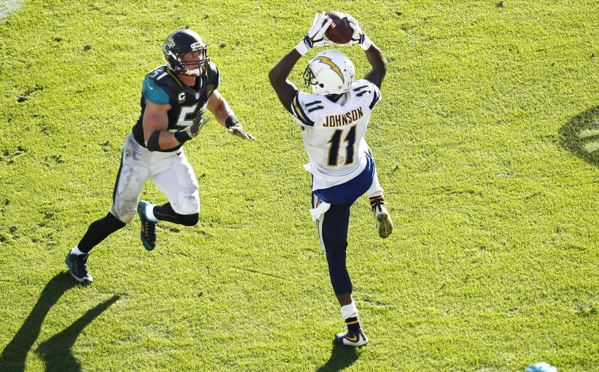 Stevie Johnson makes a touchdown grab in front of Jaguars linebacker Paul Posluszny during a game on Nov. 29.