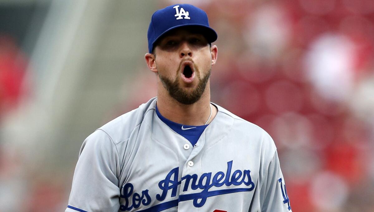 Dodgers starter Bud Norris reacts after walking Reds leadoff hitter Billy Hamilton in the first inning.