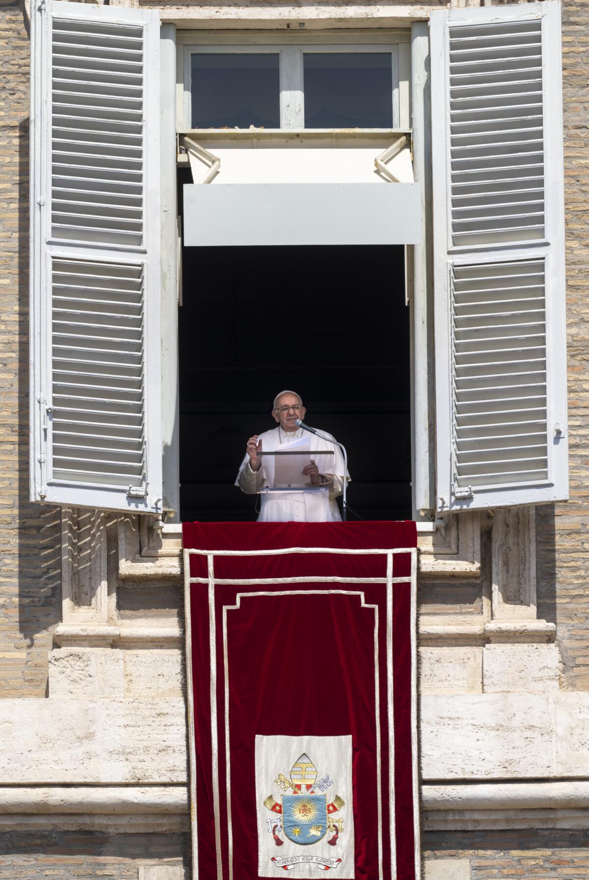 Pope Francis addresses the faithful gathered in St. Peter's Square at The Vatican, Sunday, Aug. 21, 2022, during his traditional Sunday's noon appearance. (AP Photo/Domenico Stinellis)