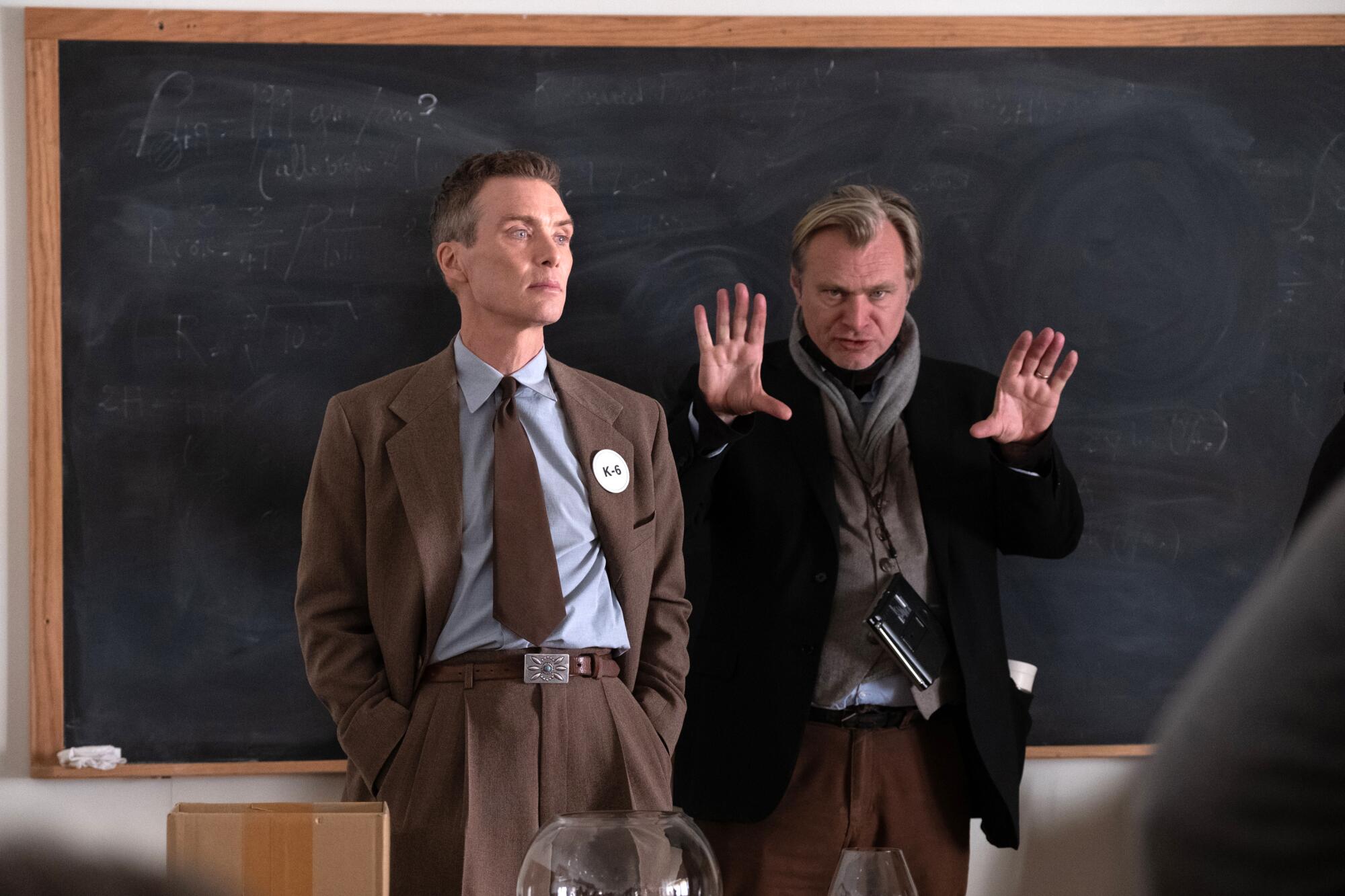 Cillian Murphy and Christopher Nolan on a classroom set for "Oppenheimer."