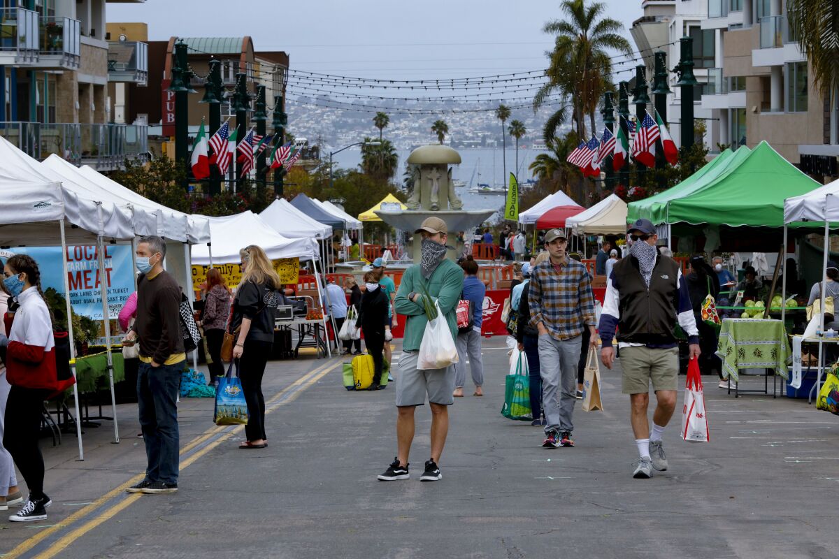 Customers were limited to 50 to enter the Farmers Market in Little Italy on Saturday. The scaled down market was limited to two blocks and sold only grocery items.
