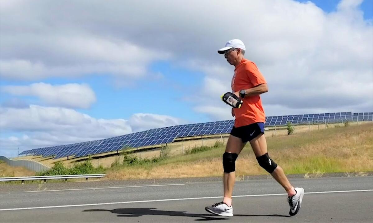 Richard Nares carried a water bottle bearing a photo of his late son, Emilio, for inspiration on his run down the West Coast.