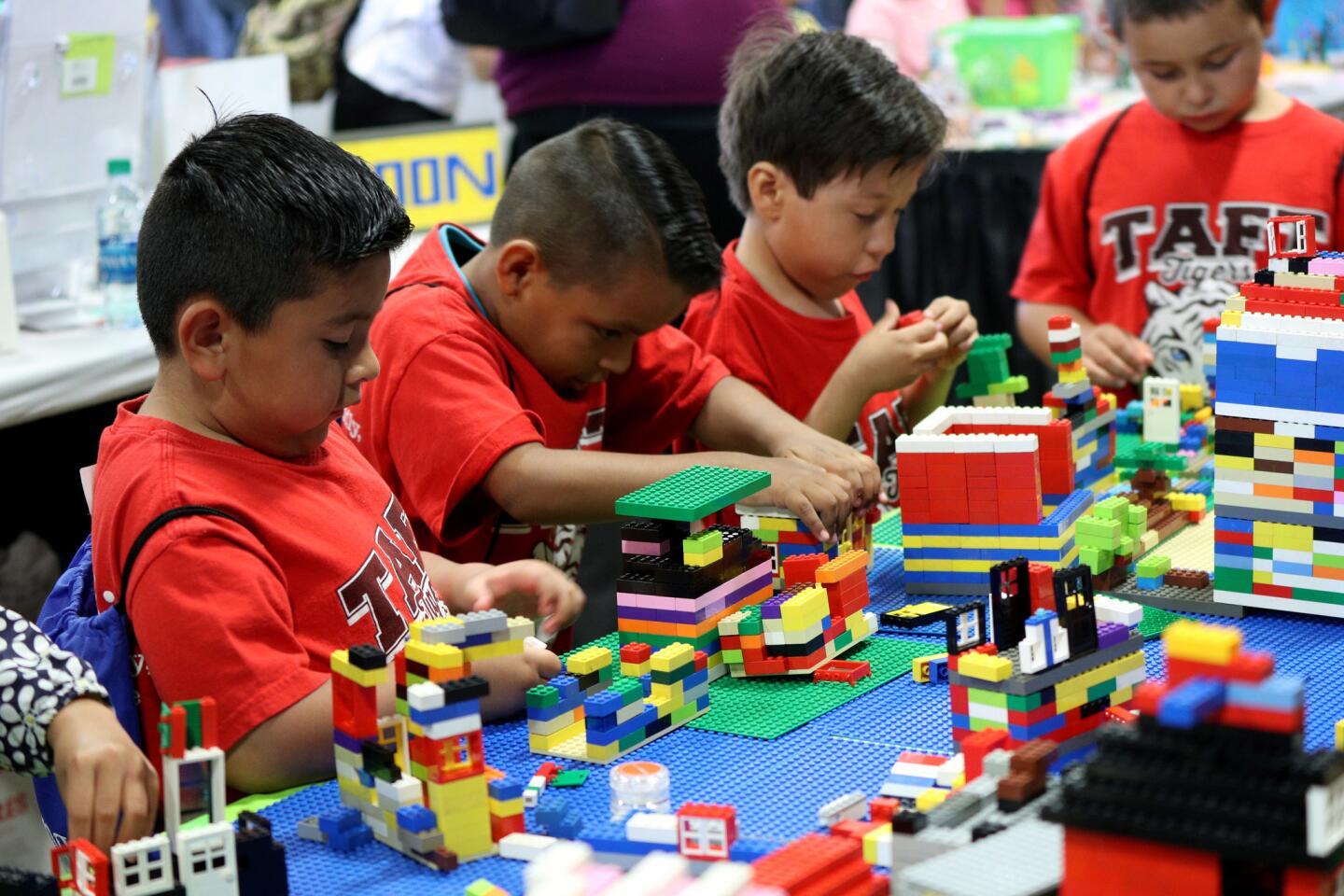 Helping make a Minecraft village at the Imaginology event are Taft Elementary School students, from left, Yandir, Alan, Emmanuel and Mikel, at the Orange County Fair and Event Center in Costa Mesa on April 12.