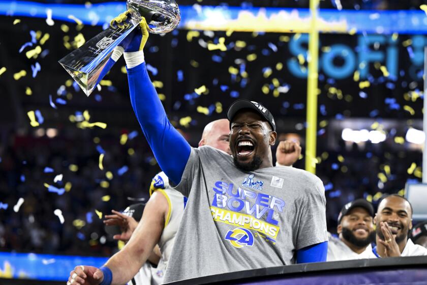 Los Angeles Rams outside linebacker Von Miller (40) holds onto the Lombardi Trophy
