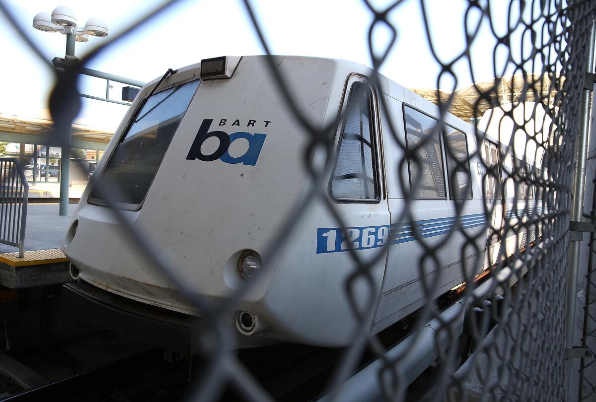 A Bay Area Rapid Transit (BART) train sits idle at the Millbrae station on July 3. Service was expected to resume at 3 p.m. Friday.