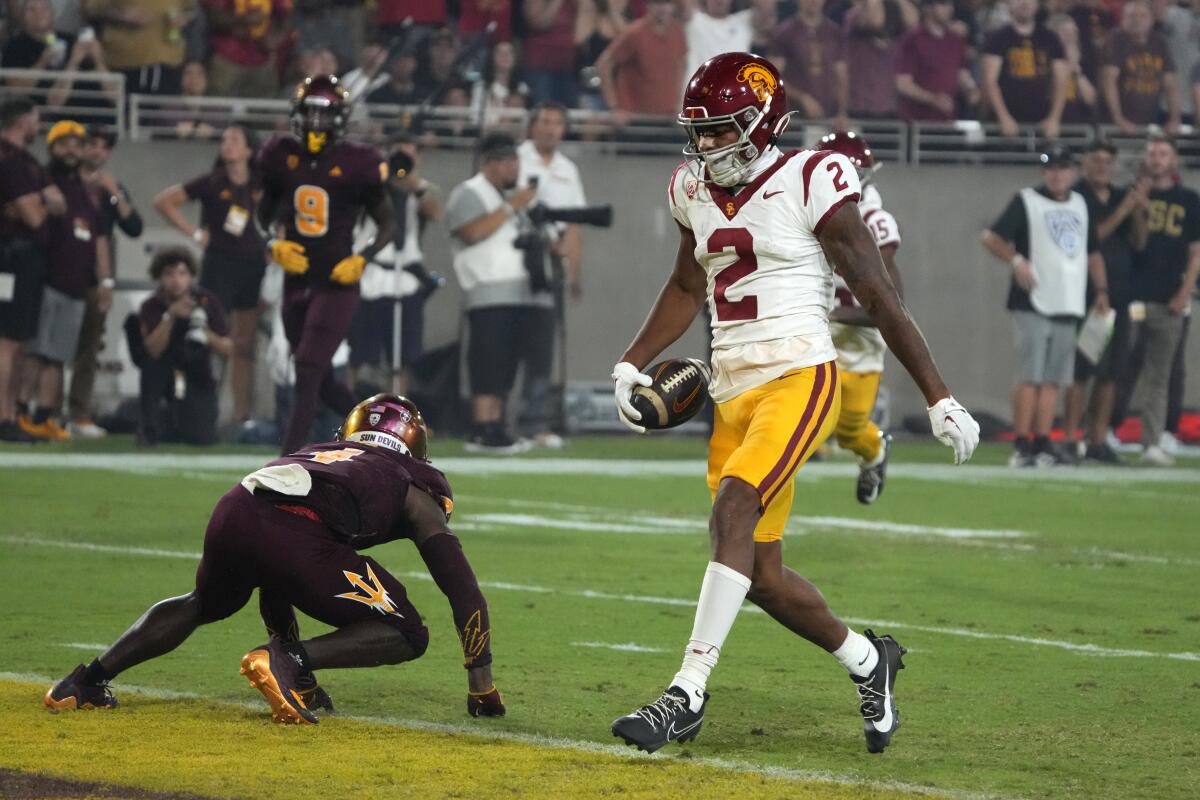 USC wide receiver Brenden Rice scores on a 43-yard touchdown reception in the first quarter