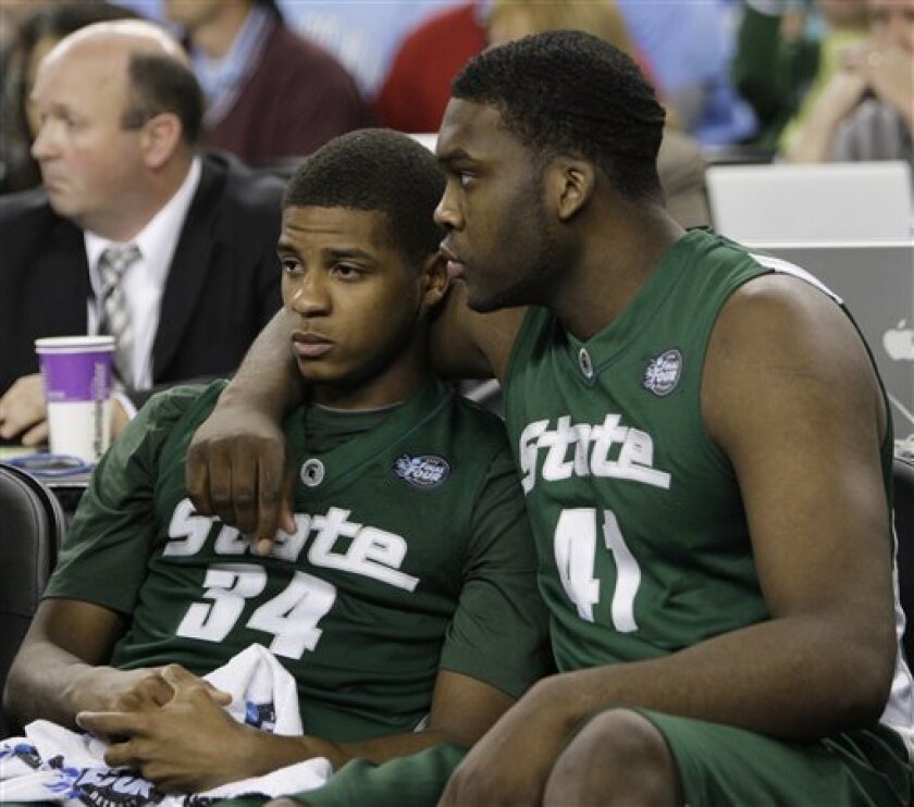 Michigan State players Korie Lucious (34) and Marquise Gray console each other on the bench after their 89-72 loss to North Carolina in the championship game at the men's NCAA Final Four college basketball tournament Monday, April 6, 2009, in Detroit. (AP Photo/Eric Gay)