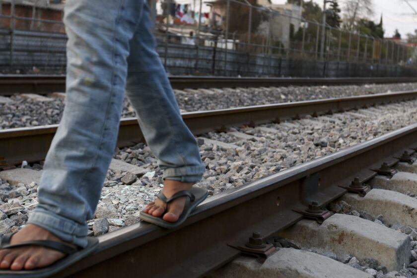 Migrants from Central American have found it increasingly difficult to cross Mexico to reach the United States. Berfilio Hernandez, 21, from Peten, Guatemala, walks along train tracks in Tultitlan, Mexico, last year.