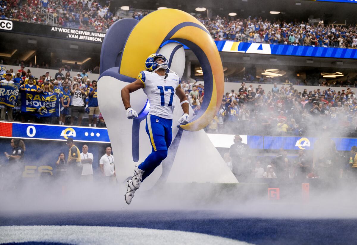 Rams receiver Puka Nacua (17) enters the field with enthusiasm before a home game against the San Francisco 49ers.