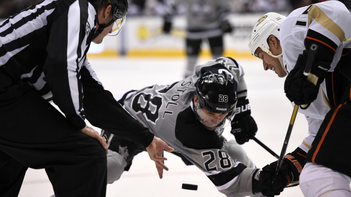 Kings center Jarret Stoll, left, and Ducks captain Ryan Getzlaf face off during the last meeting between the teams on the final weekend of the regular season. The Kings and Ducks will meet in the playoffs for the first time Saturday.