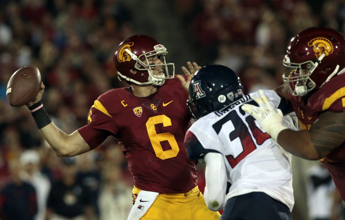 USC quarterback Cody Kessler connects with receiver Juju Smith-Schuster for a 72-yard touchdown pass against Arizona during a game at the Coliseum on Nov. 7.