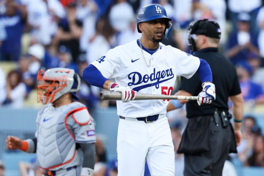 LOS ANGELES, CALIFORNIA - OCTOBER 14: Mookie Betts #50 of the Los Angeles Dodgers reacts after striking out during the ninth inning in game two of the National League Championship Series against the New York Mets at Dodger Stadium on Monday, Oct. 14, 2024 in Los Angeles. (Robert Gauthier / Los Angeles Times)