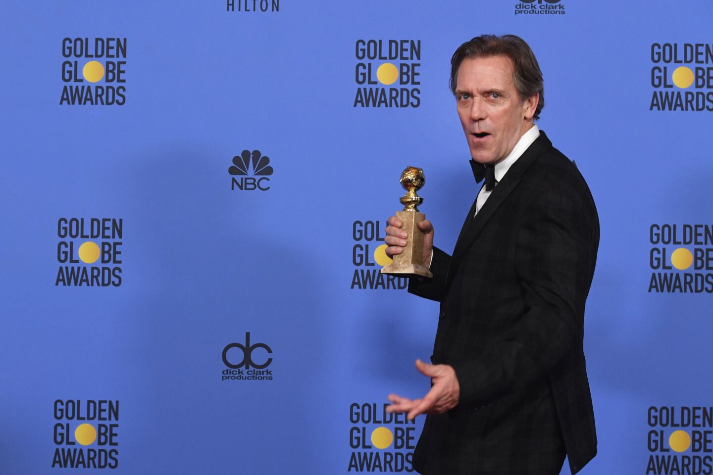 Hugh Laurie with his award for supporting actor in a series, miniseries or television film for "The Night Manager."