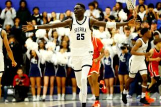 7-footer Majok Chuol of Sierra Canyon shows off his excitement during his team's 74-68 win over Harvard-Westlake.
