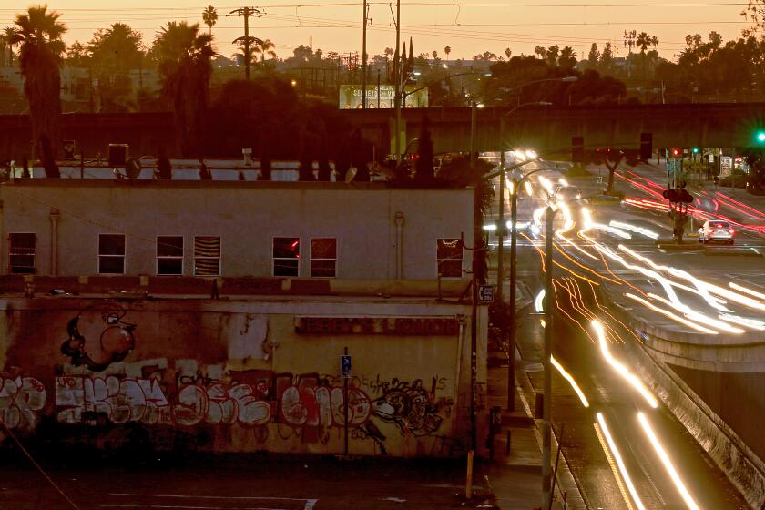 Compton, CA - Located at 124 E. Rosecrans Avenue in Compton, the building on the left formerly housed a liquor store and marijuana dispensary. (Luis Sinco / Los Angeles Times)