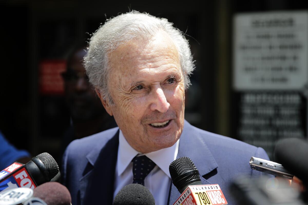 FILE - Bert Fields, an attorney for Shelly Sterling, the wife of Los Angeles Clippers owner Donald Sterling, talks to reporters as he arrives at a Los Angeles courthouse for a trial over the $2 billion Los Angeles Clippers sale on Tuesday, July 8, 2014, in Los Angeles. Fields, for decades the go-to lawyer for Hollywood A-listers including Tom Cruise, Michael Jackson, George Lucas and the Beatles, and a character as colorful as many of his clients, died Sunday, Aug. 7, 2022, at age 93. (AP Photo/Jae C. Hong, File)