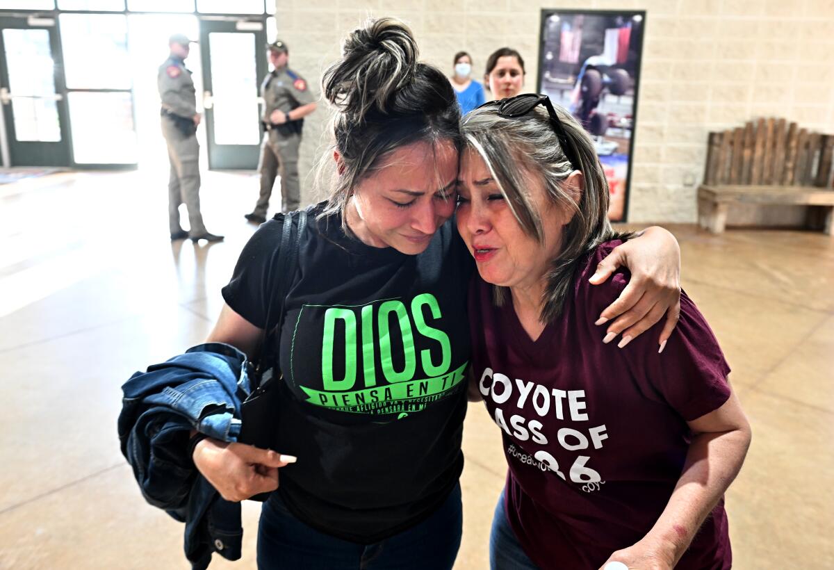 Two women consoling each other