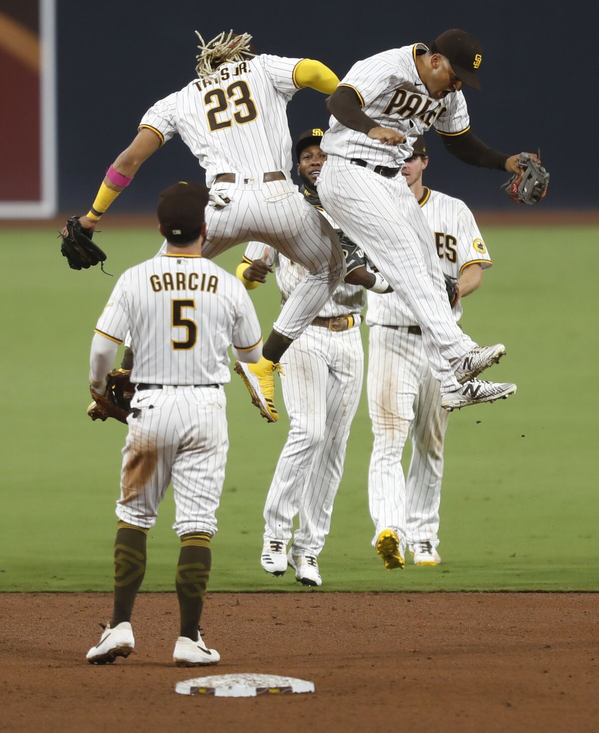 The Padres celebrate a 7-2 win over the Dodgers on Sept. 14 at Petco Park.