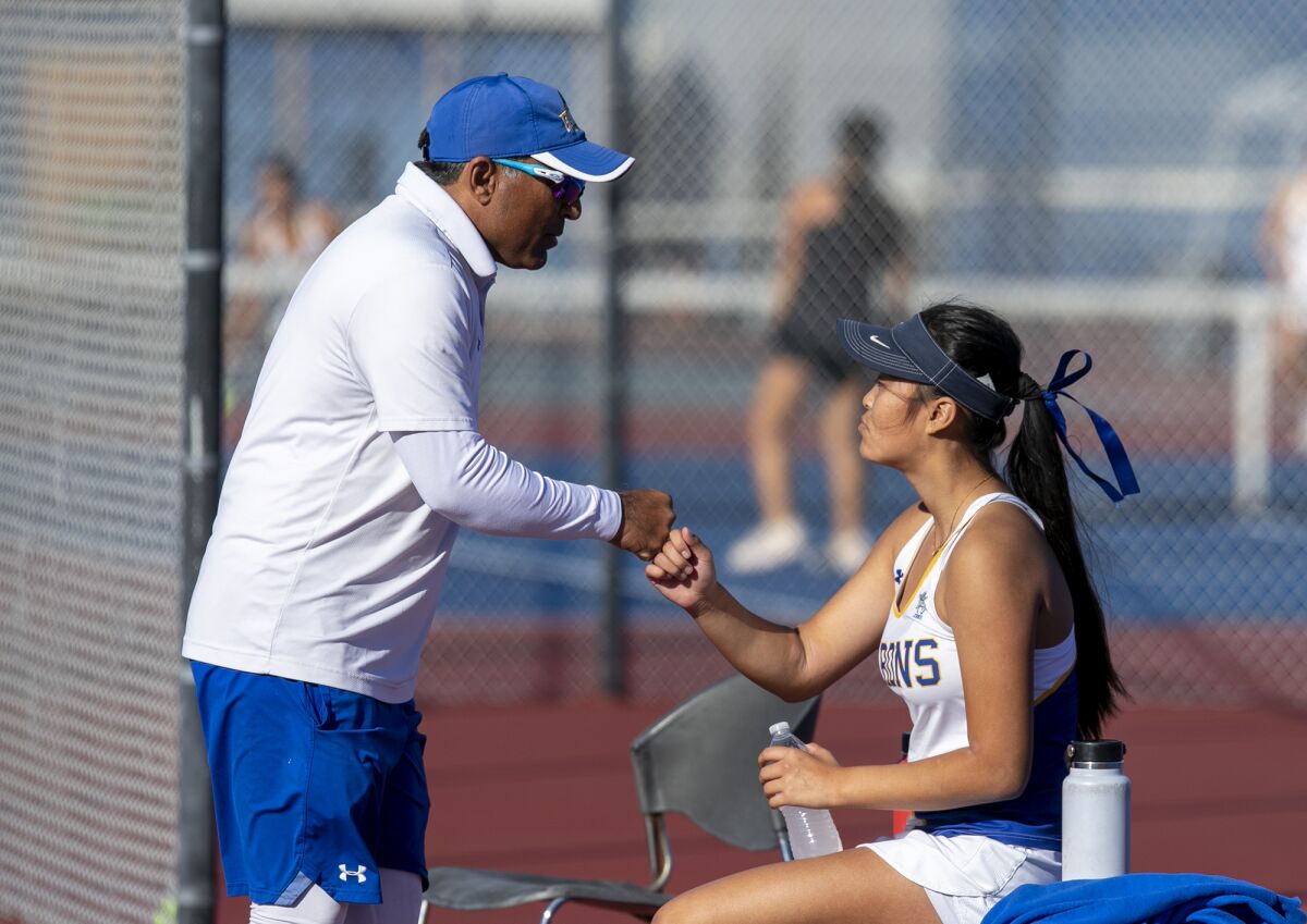 Fountain Valley's head coach Harshul Patel fist bumps Katelyn Nguyen during a CIF Southern Section Division 2 semifinal.