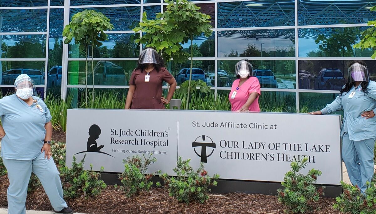 TextEditor (L-r) Wearing face masks are Kimberly Tillman, Latrice Thomas, Mamie Gooden, Chiquita Cooper
