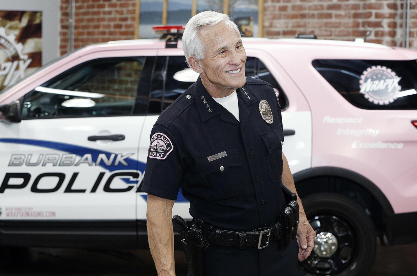 Burbank Police Chief Scott LaChasse in front of the newly wrapped pink police cruiser that was just unveiled for the Burbank Police Department at Wrapix in Burbank on Wednesday, September 26, 2018. The pink police cruiser, prepared by Wrapix who absorbed the expense, will be part of the Burbank Police Departments' recognition of Breast Cancer Awareness month in October, along with pink police emblems on each arm of the officer's uniform.