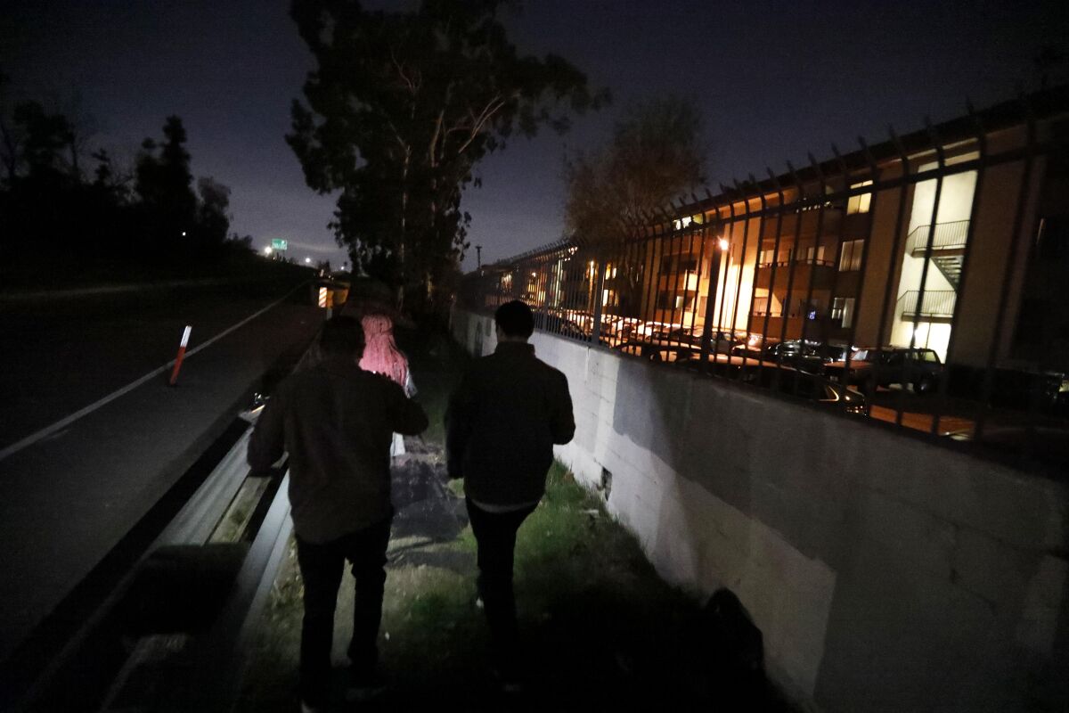 Volunteers look for homeless people during the Greater Los Angeles homeless count in North Hollywood in 2020.