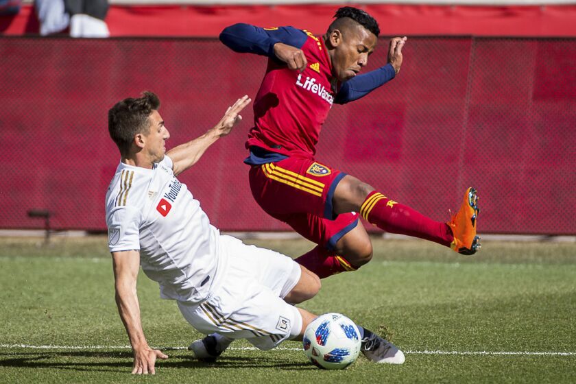 Los Angeles FC defender Dejan Jakovic (5) challenges Real Salt Lake forward Joao Plata (10) for the ball during an MLS soccer match at Rio Tinto Stadium in Sandy, Utah, Saturday March 10, 2018. LAFC won 5-1. (Trent Nelson/The Salt Lake Tribune via AP)