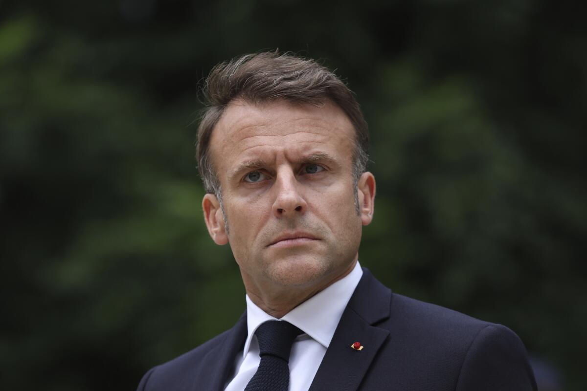 French President Emmanuel Macron, with a stern expression
