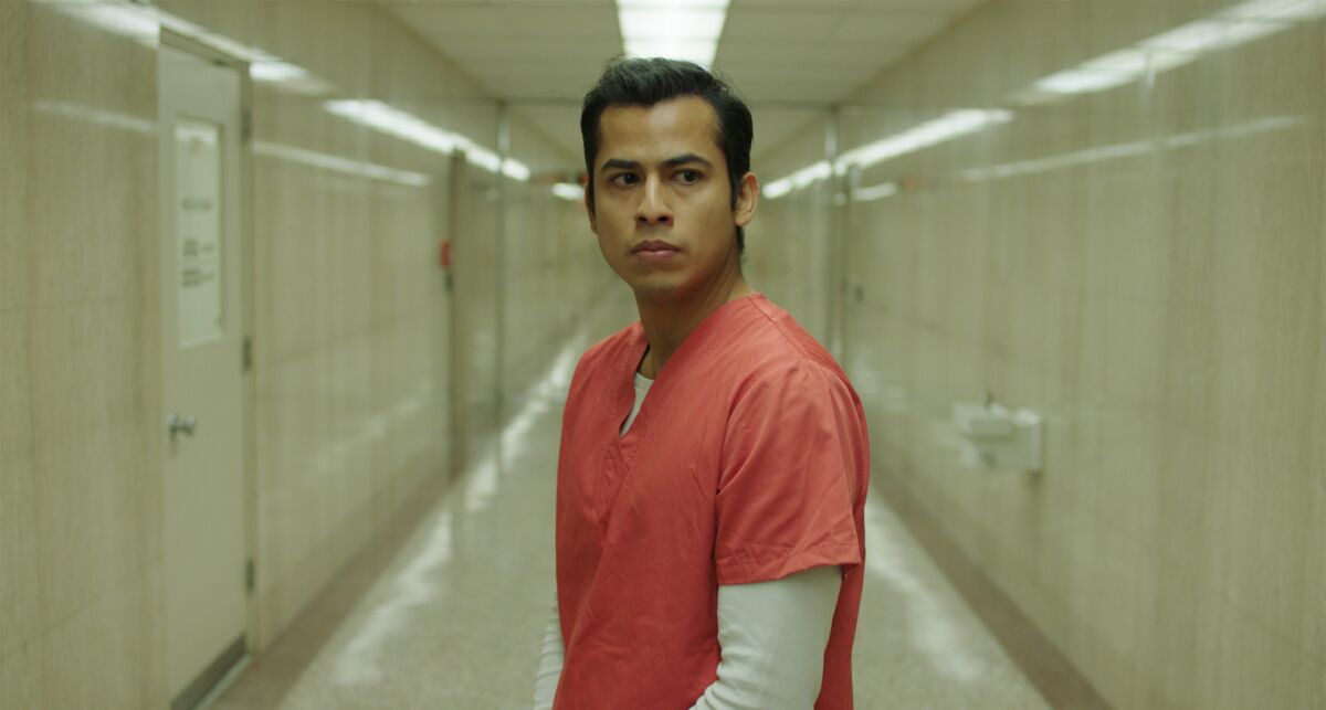 A young man in an automated prison in "Please Hold."