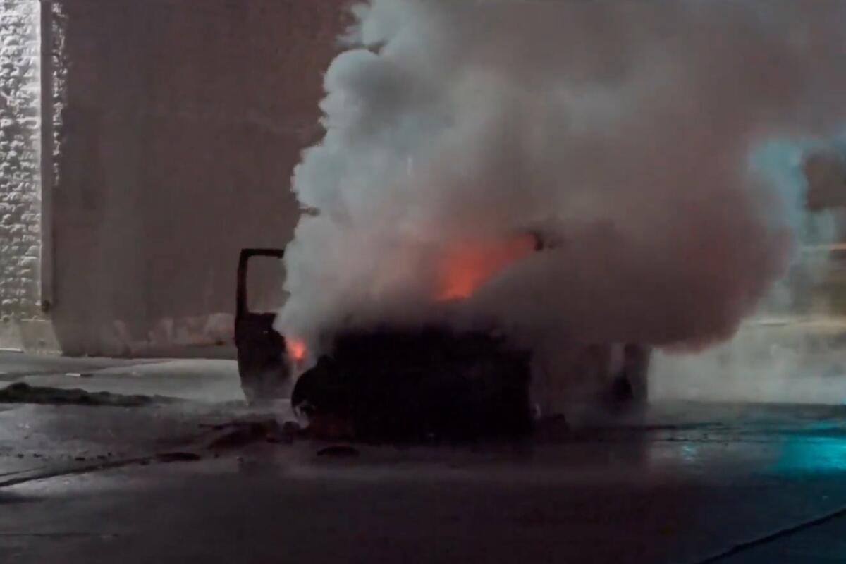 A car with a man sleeping inside was set on fire early Sunday.