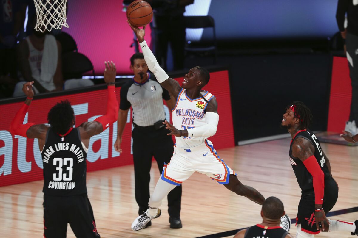 Thunder guard Dennis Schroder drives for a layup against the Rockets in Game 4 on Aug. 24, 2020.