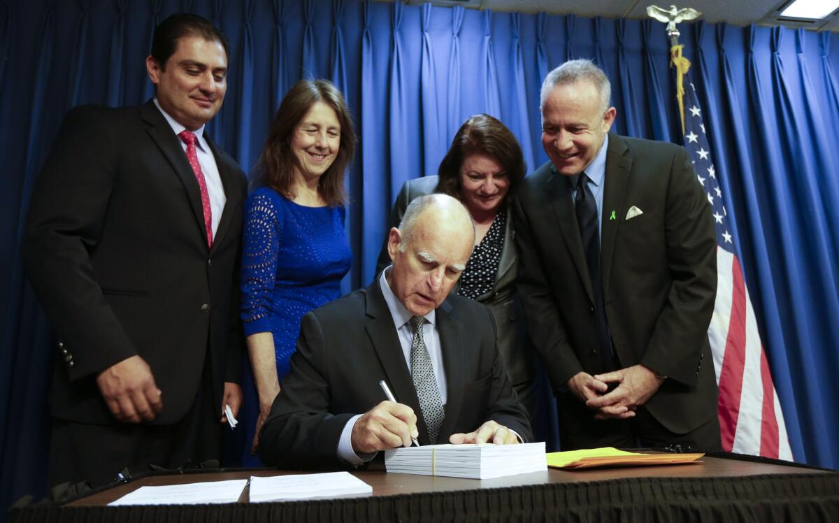 Gov. Jerry Brown signs into law California's new budget last week. On Tuesday, he signed another bill intended to fix the teacher pension fund.