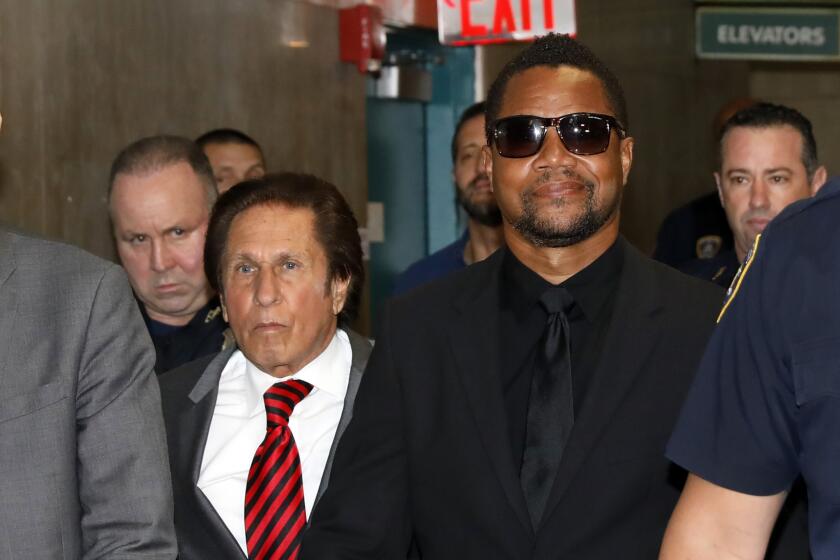 Cuba Gooding Jr., right, with his attorney Mark Heller, arrives at criminal court in New York, Wednesday, June 26, 2019. Lawyers for Cuba Gooding Jr. are providing a court with video they say will show the actor did not grope a woman at a New York City bar. (AP Photo/Richard Drew)