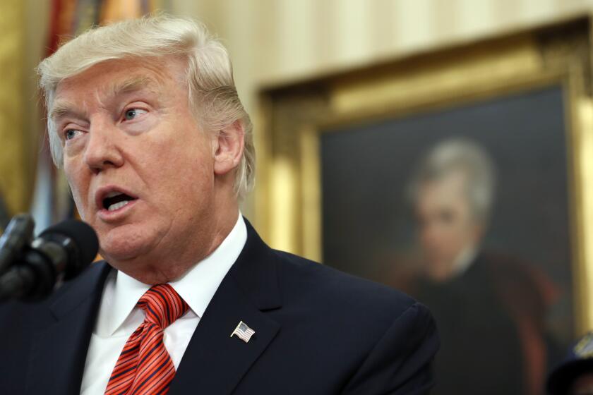 President Donald Trump, with a portrait of President Andrew Jackson behind him, speaks during a meeting with survivors of the attack on USS Arizona at Pearl Harbor, in the Oval Office of the White House, Friday, July 21, 2017, in Washington. (AP Photo/Alex Brandon)